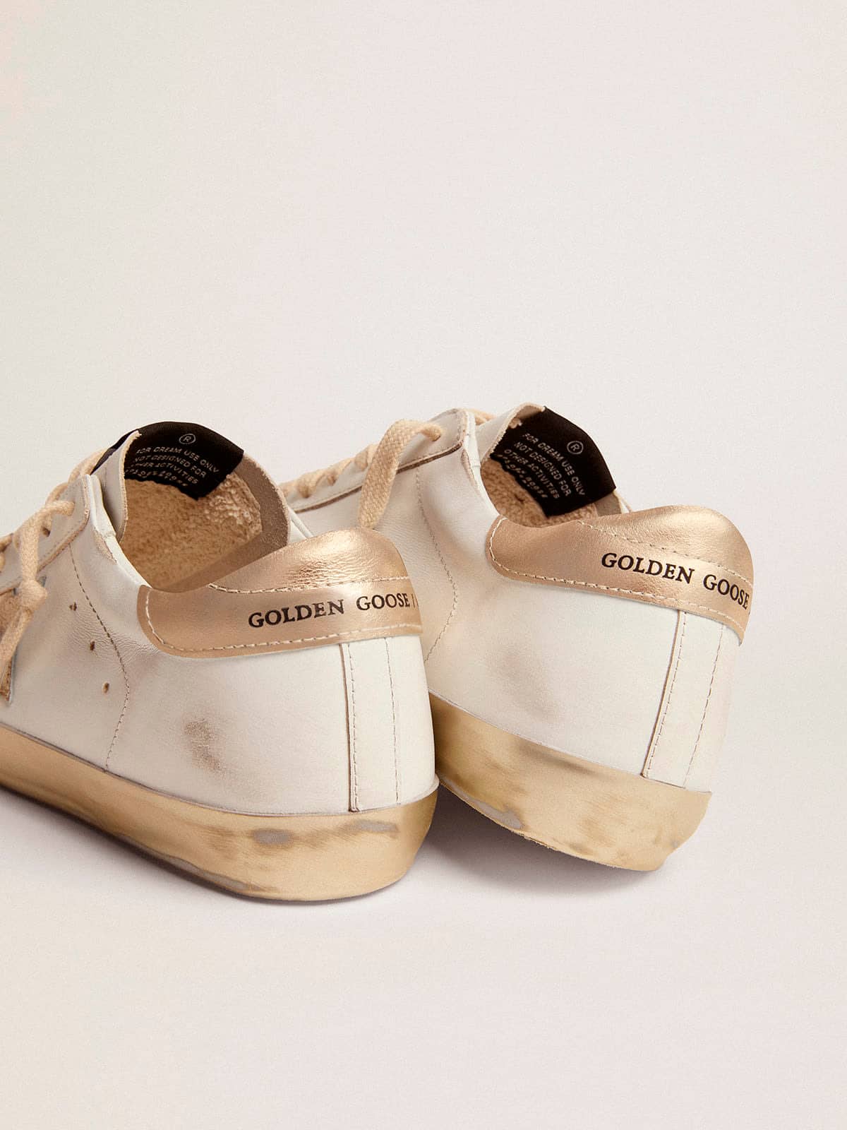 Women's Super-Star with gold sparkle foxing and metal stud lettering sneakers