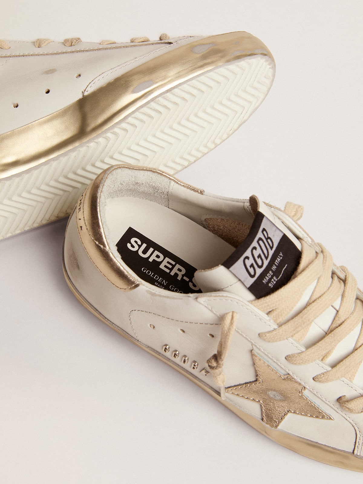 Women's Super-Star with gold sparkle foxing and metal stud lettering sneakers