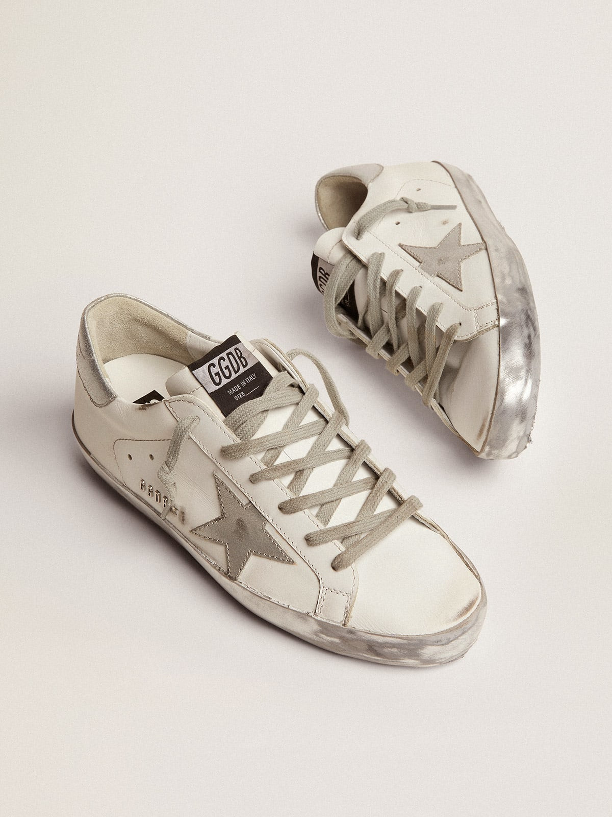 Women's Super-Star with silver sparkle foxing and metal stud lettering sneakers