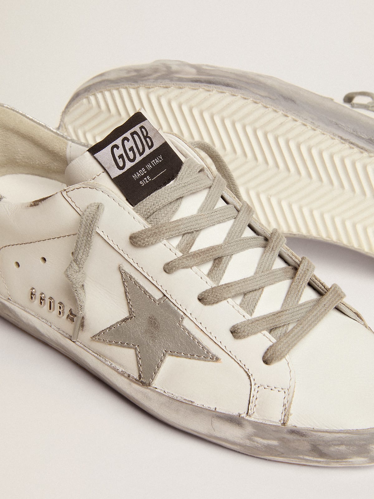 Women's Super-Star with silver sparkle foxing and metal stud lettering sneakers